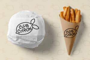 Burger dans du papier ingraissable logoté et cornet de frites personnalisé pour vente à emporter